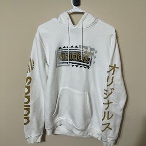 Vintage Adidas white hoodie with gold and black detailing and embroidered logo